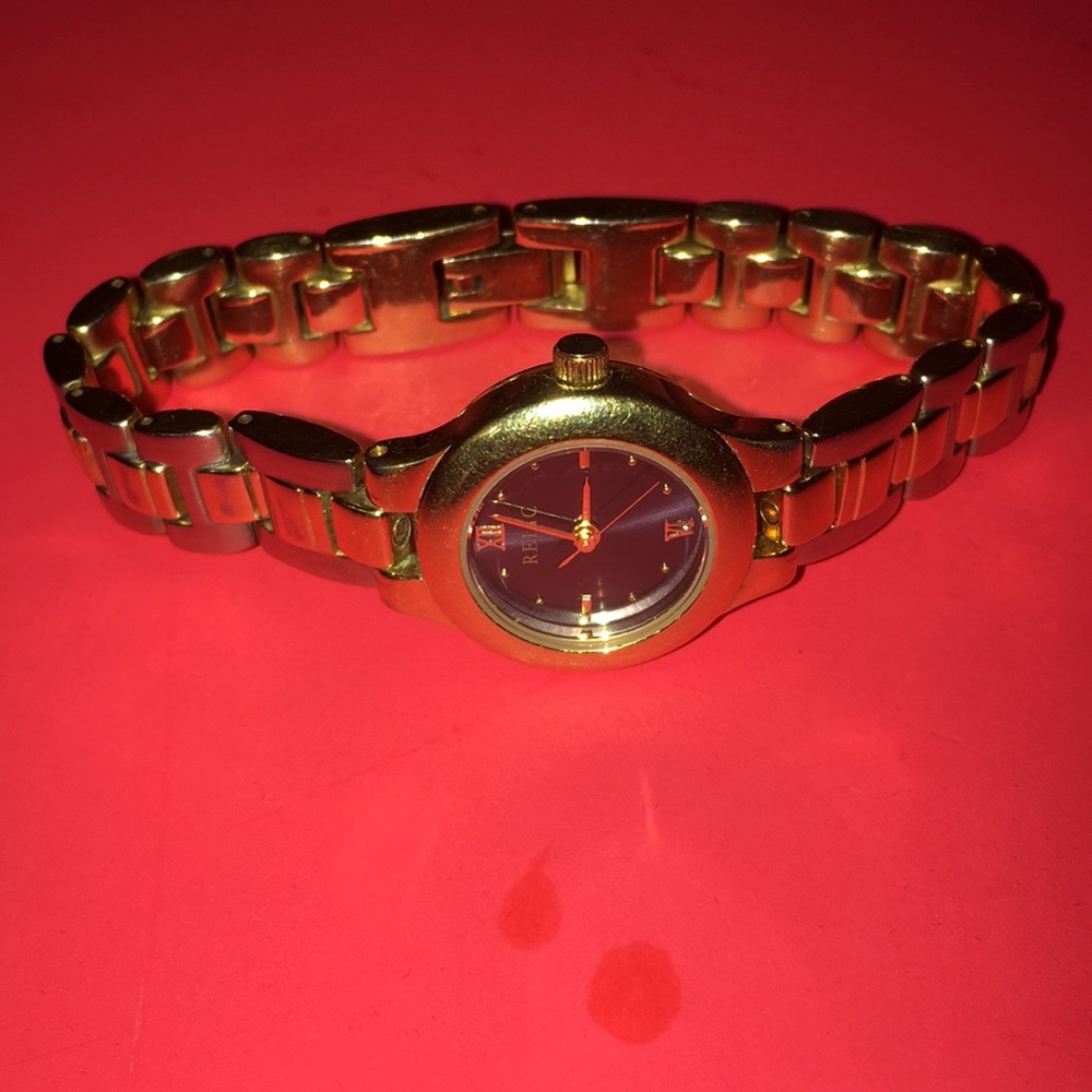 Ladies Relic Gold tone stainless blue dial face